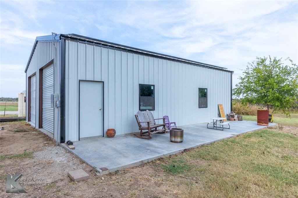 917 County Road 3798 Springtown, TX 76082 - Photo 31 of 40 a backyard of a house with seating space