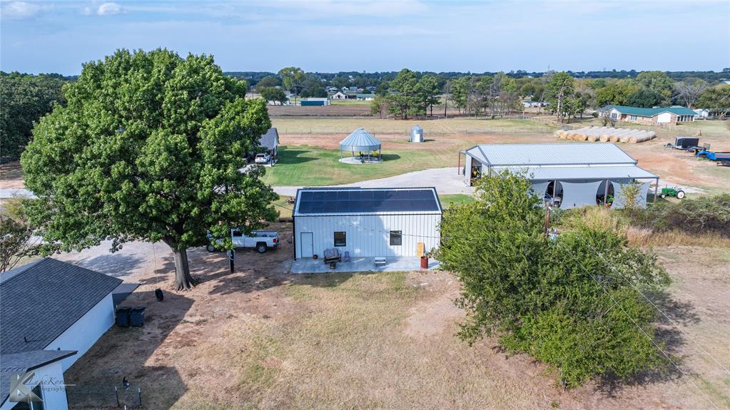 917 County Road 3798 Springtown, TX 76082 - Photo 37 of 40 an aerial view of a house with a yard and lake view