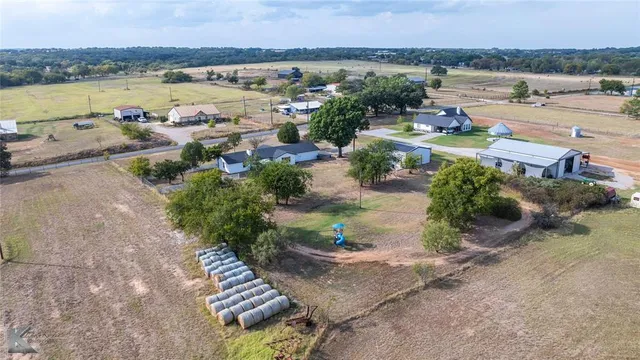 an aerial view of a house with a garden