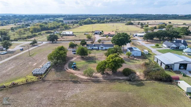 a aerial view of a house with a lake view