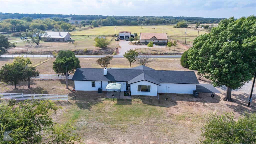 917 County Road 3798 Springtown, TX 76082 - Photo 40 of 40 a aerial view of a house with a lake view