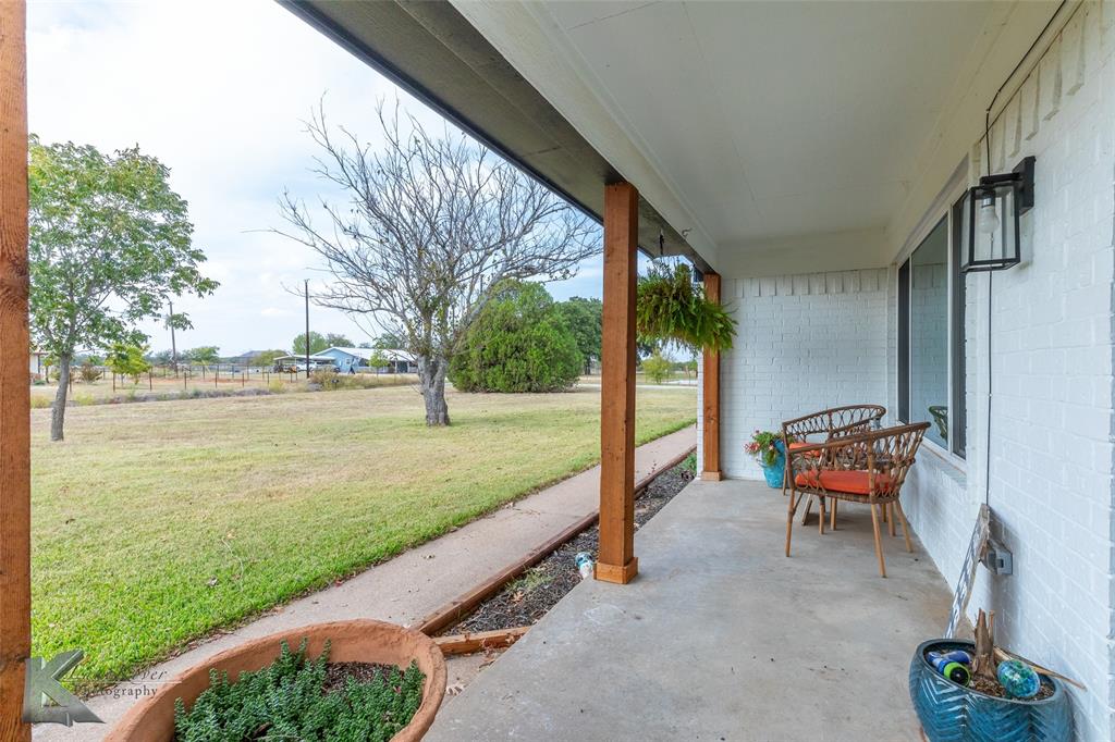 917 County Road 3798 Springtown, TX 76082 - Photo 5 of 40 a backyard of a house with outdoor seating