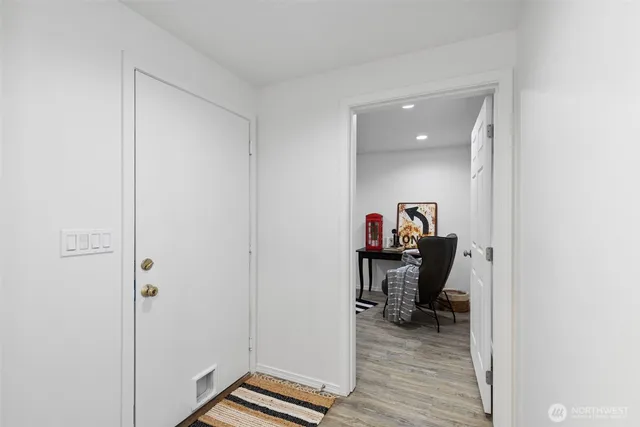 a living room with furniture and a chair