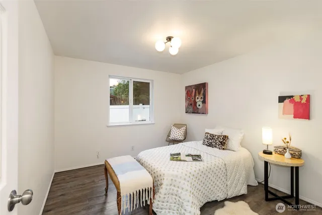 a bedroom with a bed and chair