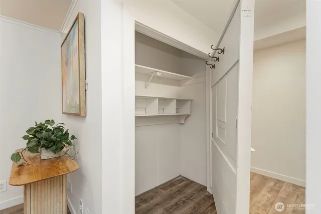 a living room with furniture a table and a large window