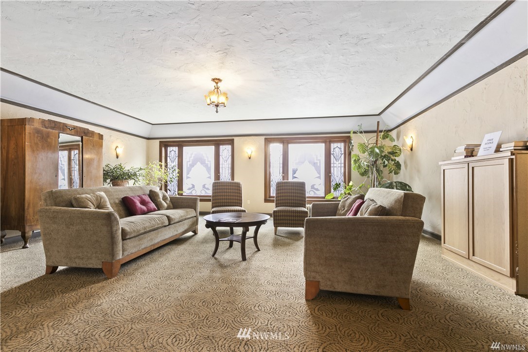 519 West Roy Street, Unit 408 Seattle, WA 98119 - Photo 3 of 25 a living room with furniture and a large window