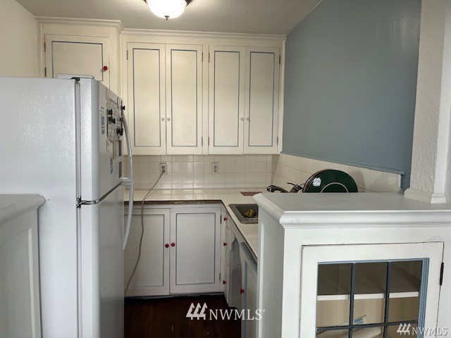 519 West Roy Street, Unit 408 Seattle, WA 98119 - Photo 10 of 25 a kitchen with a stove and a refrigerator