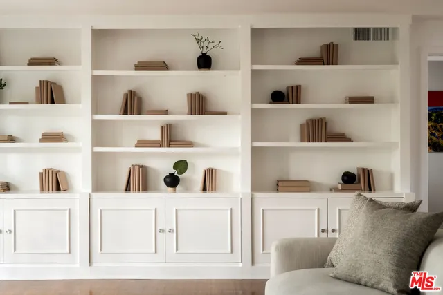 a living room with cabinets
