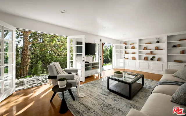 a living room with furniture fireplace and a flat screen tv