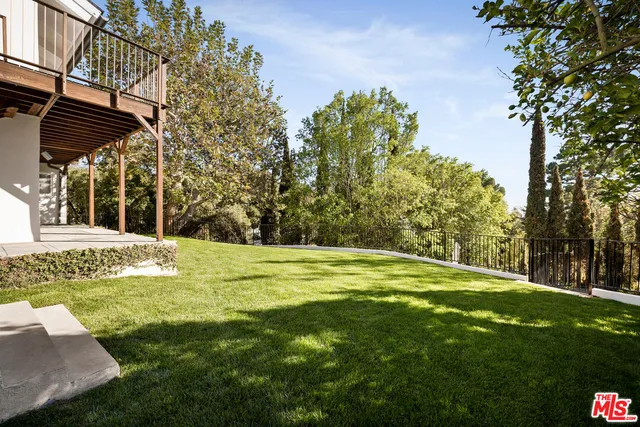 a view of a swimming pool with a garden