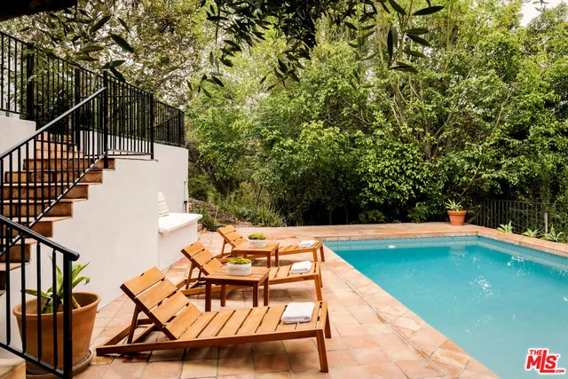 a view of swimming pool with lounge chair