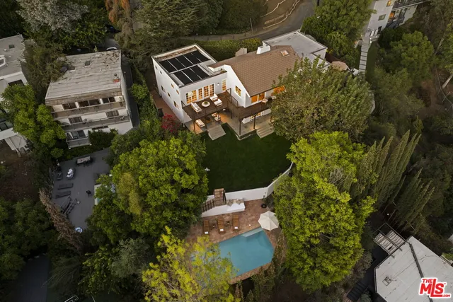 a balcony with next to a yard