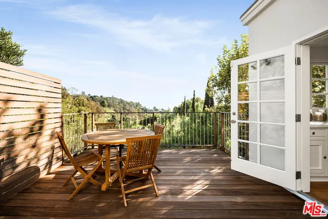 a view of a chairs and table on the terrace