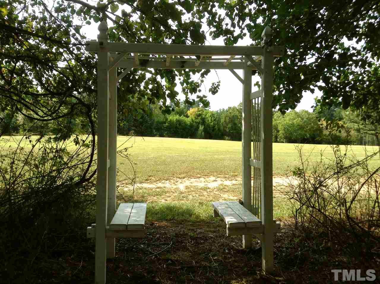 12600-12604 Shooting Club Road Raleigh, NC 27613 - Photo 4 of 5 a view of an outdoor space and a yard