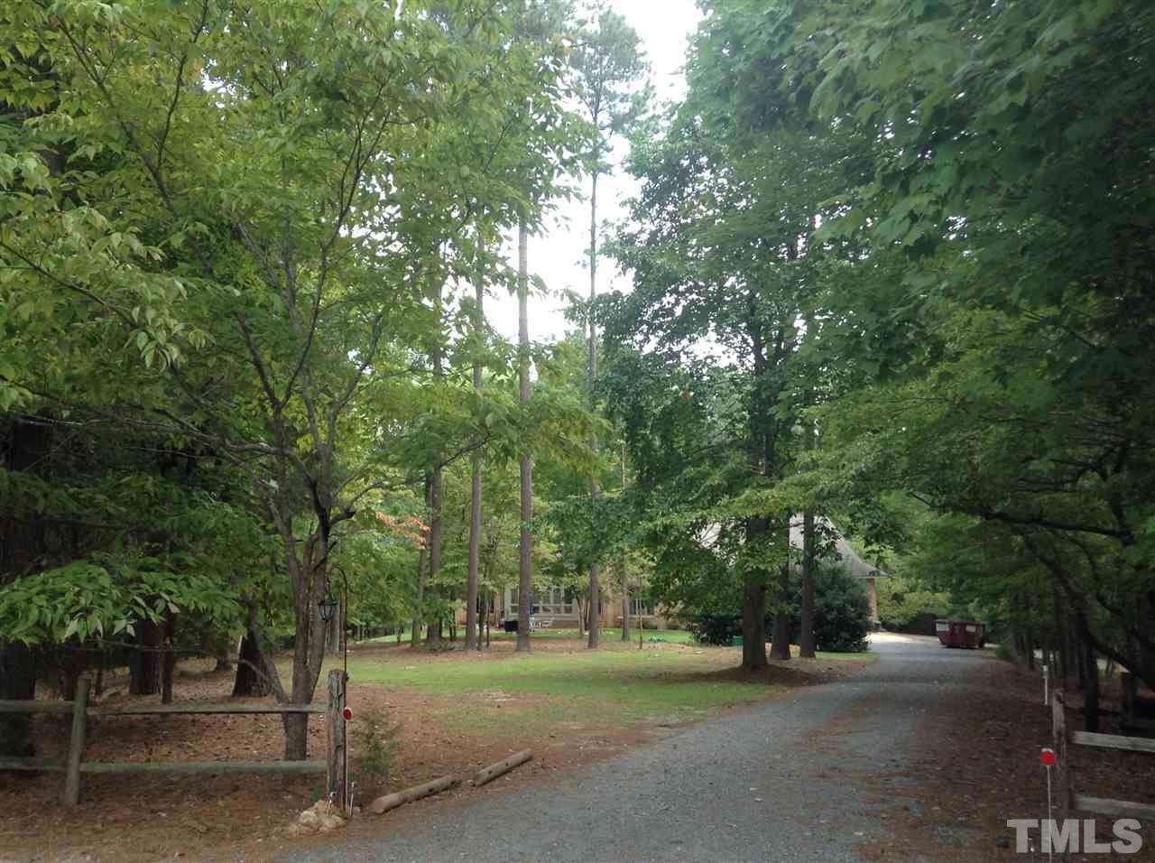 12600-12604 Shooting Club Road Raleigh, NC 27613 - Photo 5 of 5 a view of a road with trees and cars