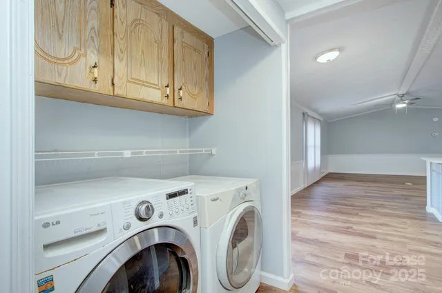 a view of storage and utility room with washer and dryer