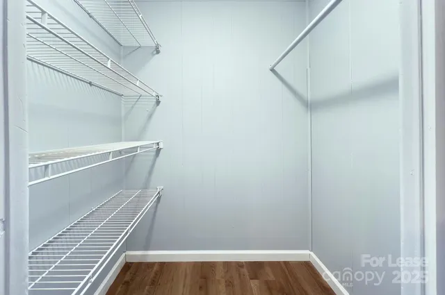 a view of staircase with white walls