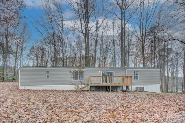 a view of backyard space with large trees