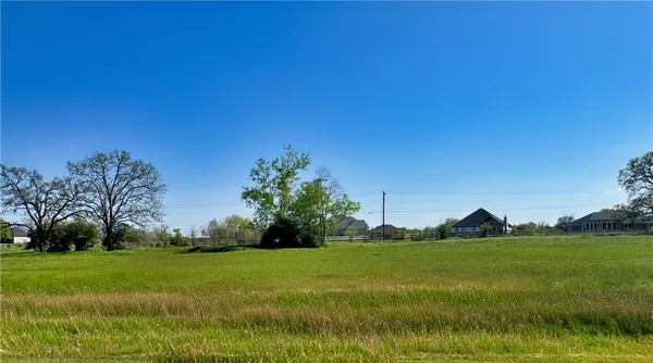 an aerial view of residential houses with outdoor space and swimming pool