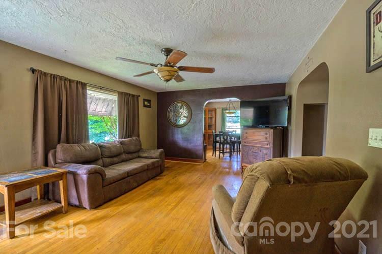 1411 Newfound Road Canton, NC 28716 - Photo 14 of 24 a living room with furniture and a large window