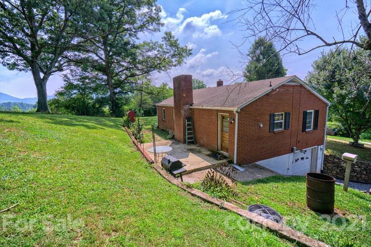 1411 Newfound Road Canton, NC 28716 - Photo 22 of 24 a view of backyard of house and car parked