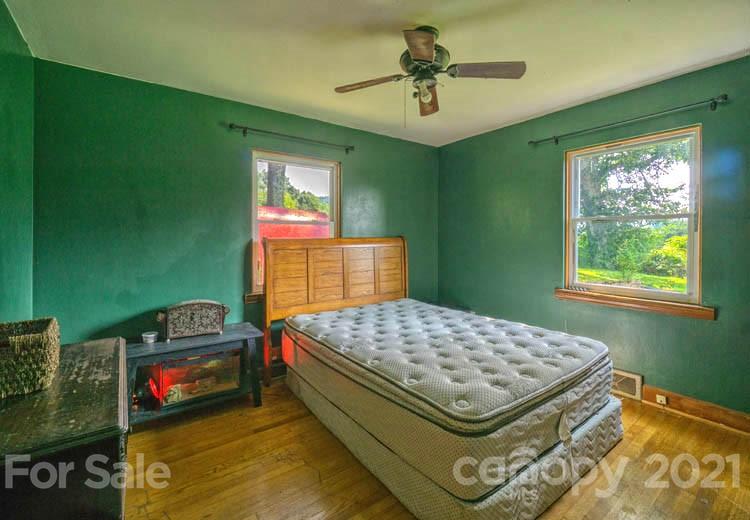 1411 Newfound Road Canton, NC 28716 - Photo 5 of 24 a bedroom with a bed and a dresser