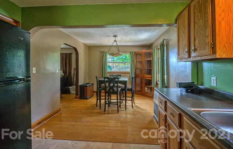 1411 Newfound Road Canton, NC 28716 - Photo 8 of 24 a dining room with furniture and a large window