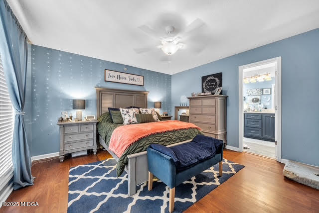 116 Newport Road Northeast Milledgeville, GA 31061 - Photo 19 of 30 a bedroom with a bed and wooden floor