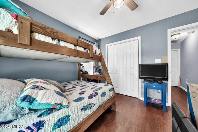 116 Newport Road Northeast Milledgeville, GA 31061 - Photo 25 of 30 a bedroom with a bed tv and a window