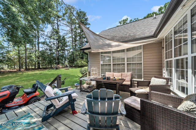 116 Newport Road Northeast Milledgeville, GA 31061 - Photo 27 of 30 a backyard of a house with outdoor seating
