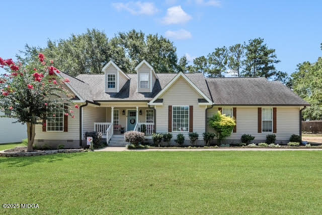 116 Newport Road Northeast Milledgeville, GA 31061 - Photo 3 of 30 a front view of a house with a garden