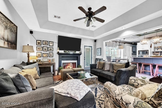 116 Newport Road Northeast Milledgeville, GA 31061 - Photo 7 of 30 a living room with furniture a flat screen tv and a fireplace