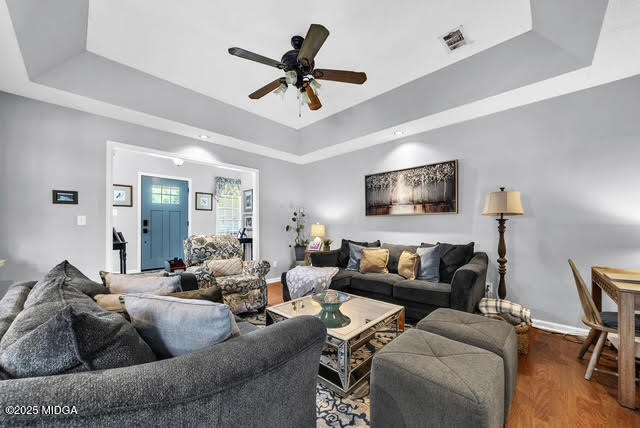 116 Newport Road Northeast Milledgeville, GA 31061 - Photo 8 of 30 a living room with furniture and a ceiling fan