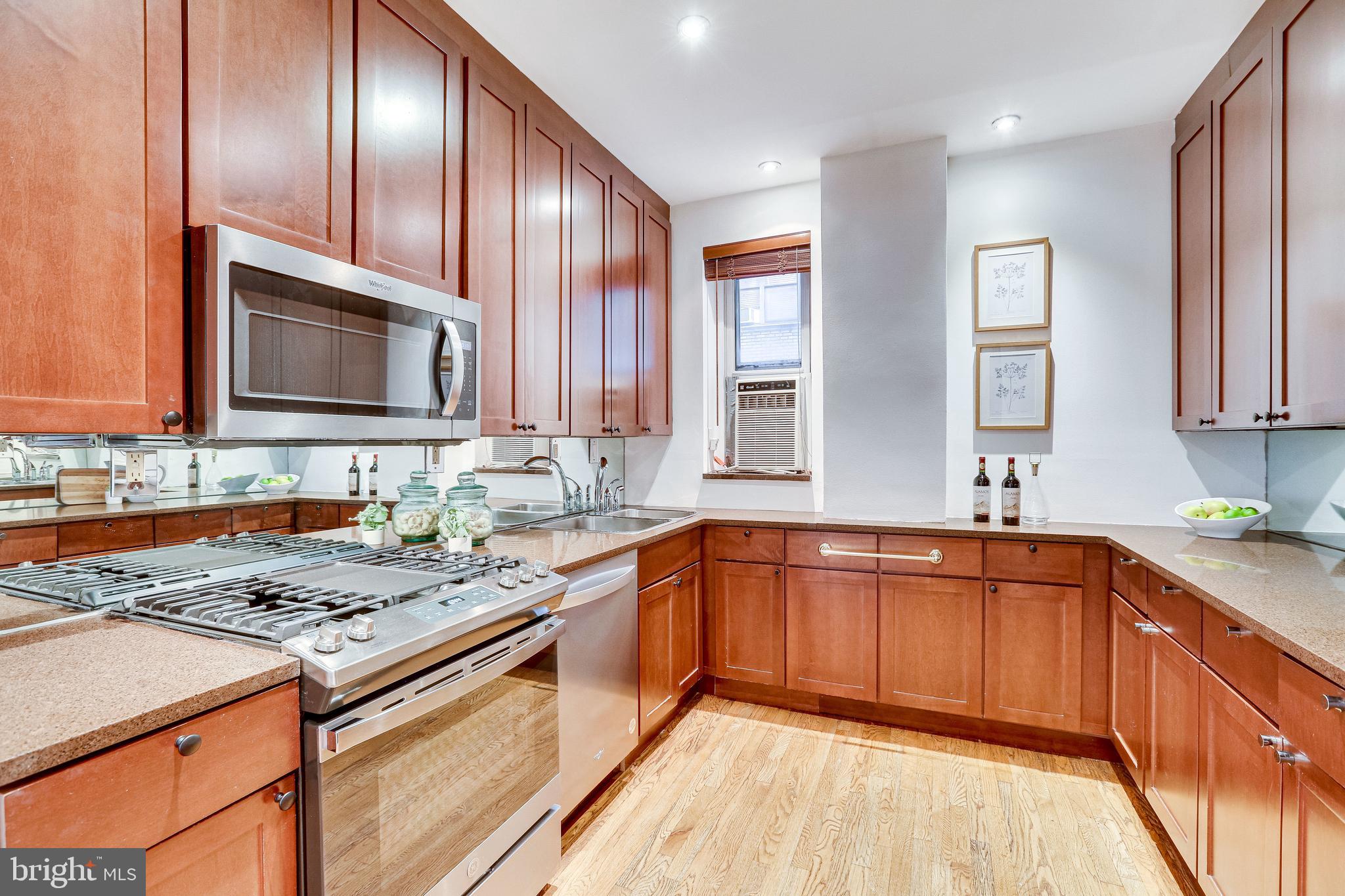 1514 17th Street Northwest, Unit 107 Washington, DC 20036 - Photo 16 of 63 Kitchen featuring granite counters
