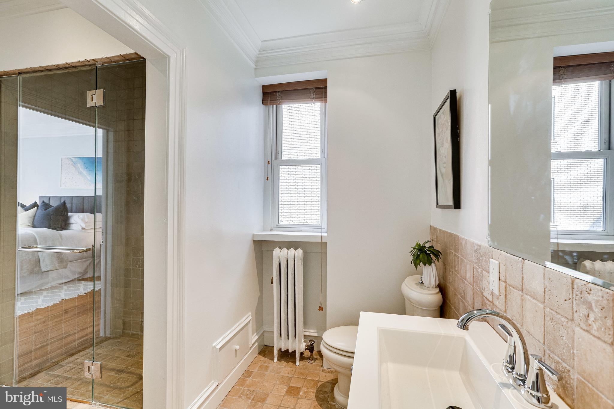 1514 17th Street Northwest, Unit 107 Washington, DC 20036 - Photo 24 of 63 Bathroom with new vanity, sink & mirror