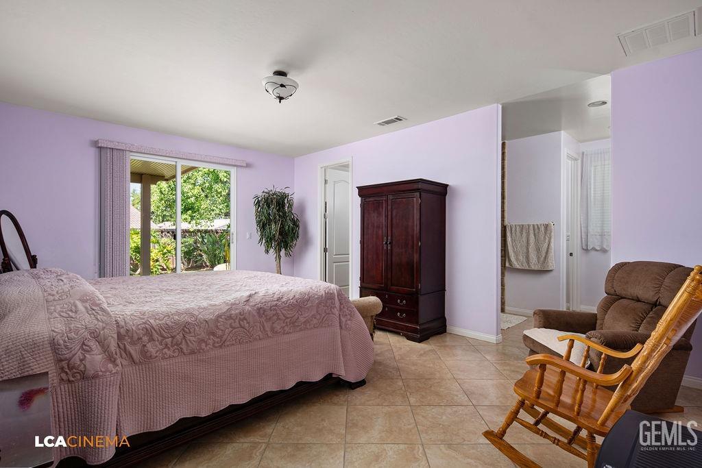 Undisclosed Address Bakersfield, CA 93306 - Photo 14 of 51 a bedroom with a bed and a window