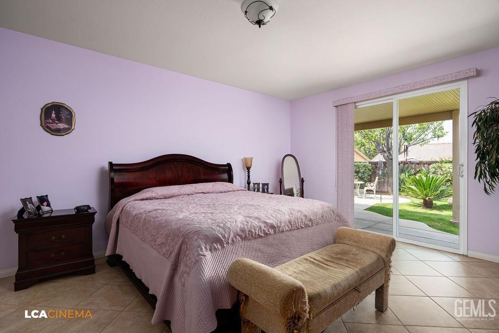 Undisclosed Address Bakersfield, CA 93306 - Photo 15 of 51 a bedroom with a bed and a window