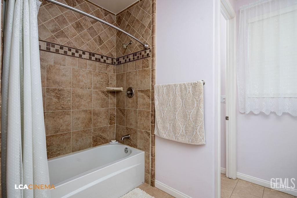 Undisclosed Address Bakersfield, CA 93306 - Photo 17 of 51 a bathroom with a shower and a bath tub