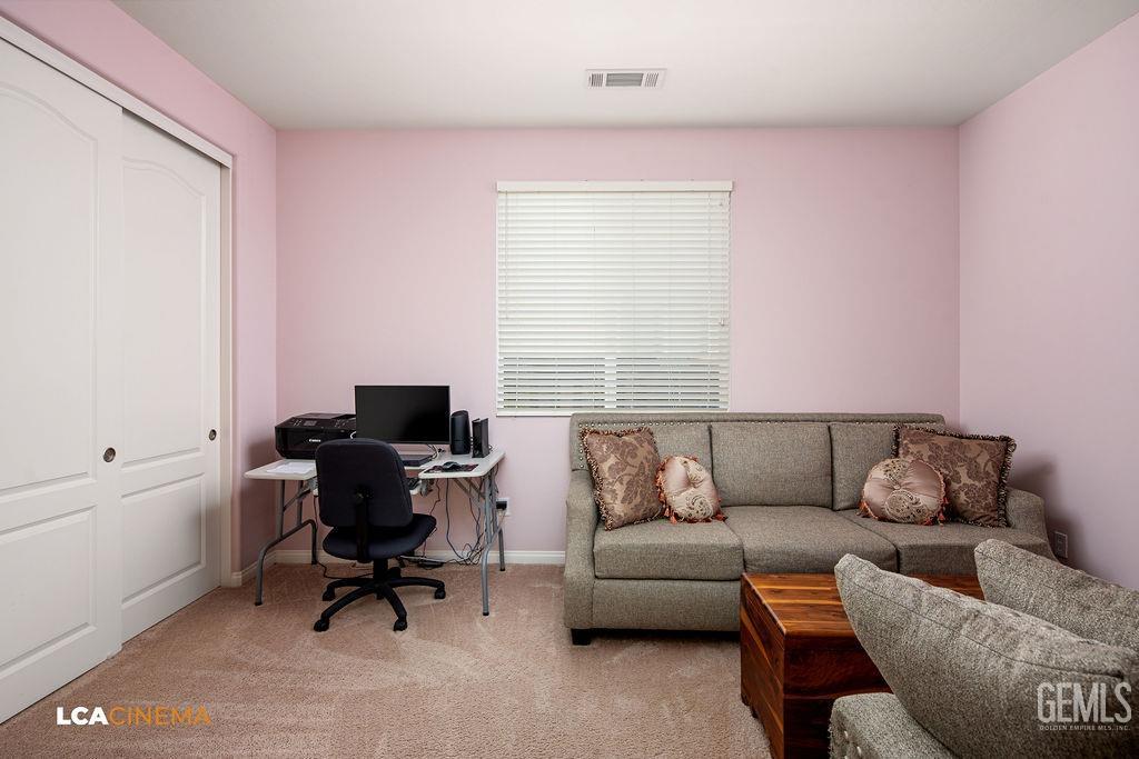 Undisclosed Address Bakersfield, CA 93306 - Photo 18 of 51 a living room with furniture and a window