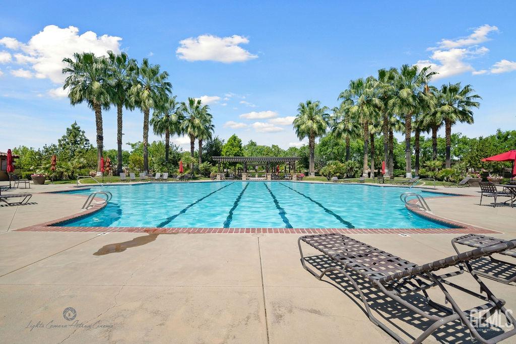 Undisclosed Address Bakersfield, CA 93306 - Photo 30 of 51 a view of a swimming pool with a yard
