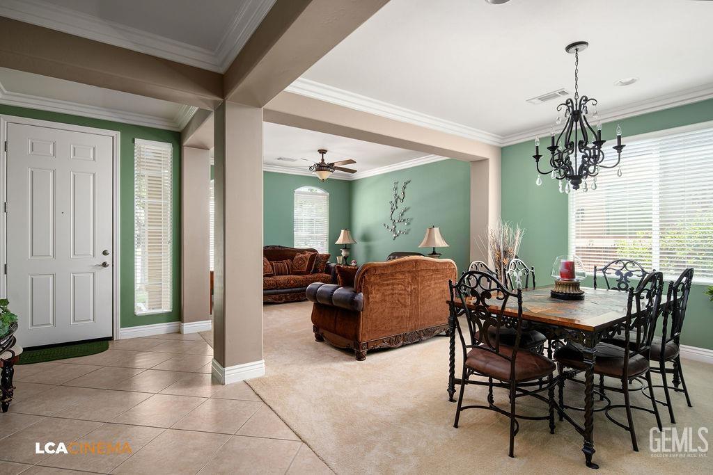 Undisclosed Address Bakersfield, CA 93306 - Photo 3 of 51 a living room with furniture and a chandelier