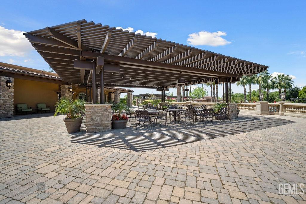 Undisclosed Address Bakersfield, CA 93306 - Photo 37 of 51 a view of a patio with table and chairs and potted plants