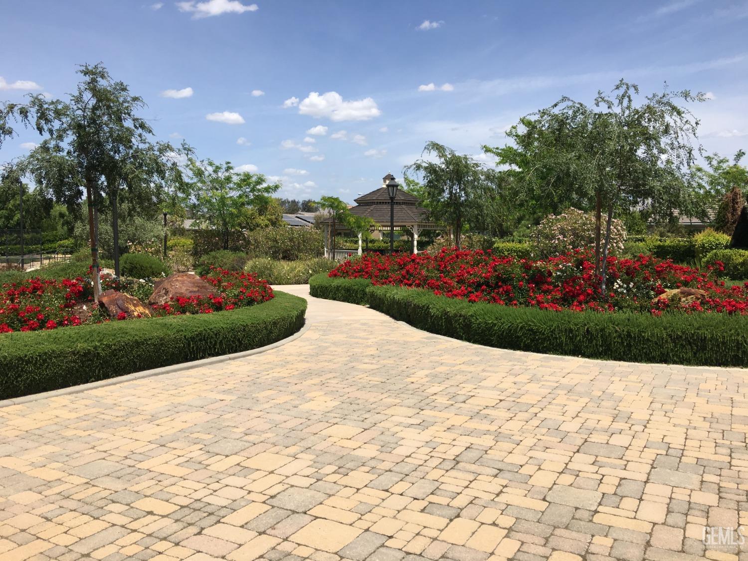 Undisclosed Address Bakersfield, CA 93306 - Photo 39 of 51 a view of a garden with flowers and plants