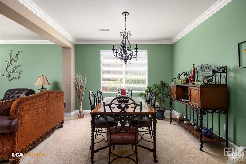 Undisclosed Address Bakersfield, CA 93306 - Photo 5 of 51 a view of a dining room with furniture and a chandelier