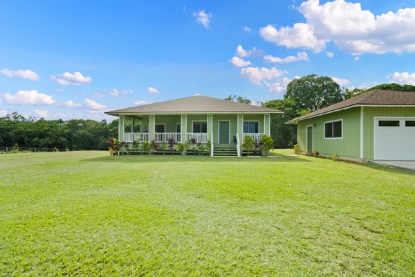a outdoor view of a house with a garden
