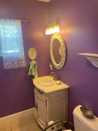a white toilet sitting next to a bath tub shower