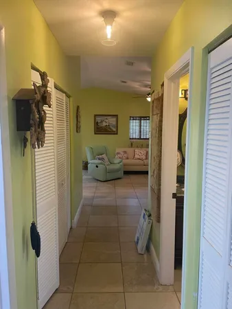 a bathroom with a toilet and a shower curtain