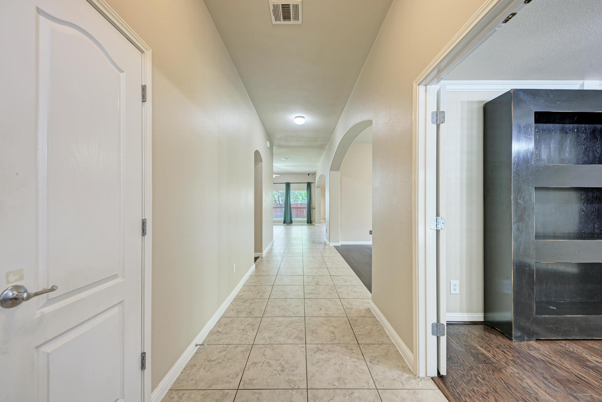 18308 Shallow Pool Drive Pflugerville, TX 78660 - Photo 4 of 40 To the right is the large office. Door to the left opens to the garage.
