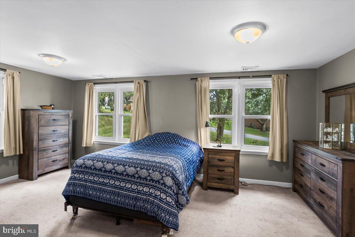330 Sylvan Retreat Road Columbia, PA 17512 - Photo 11 of 26 Serene bedroom with natural light and charm.