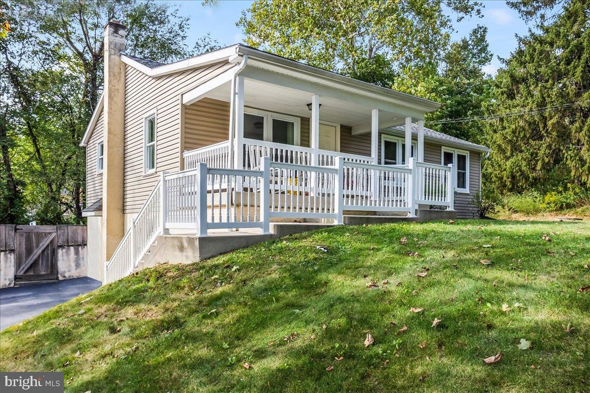 330 Sylvan Retreat Road Columbia, PA 17512 - Photo 3 of 26 Charming home with inviting porch and greenery.